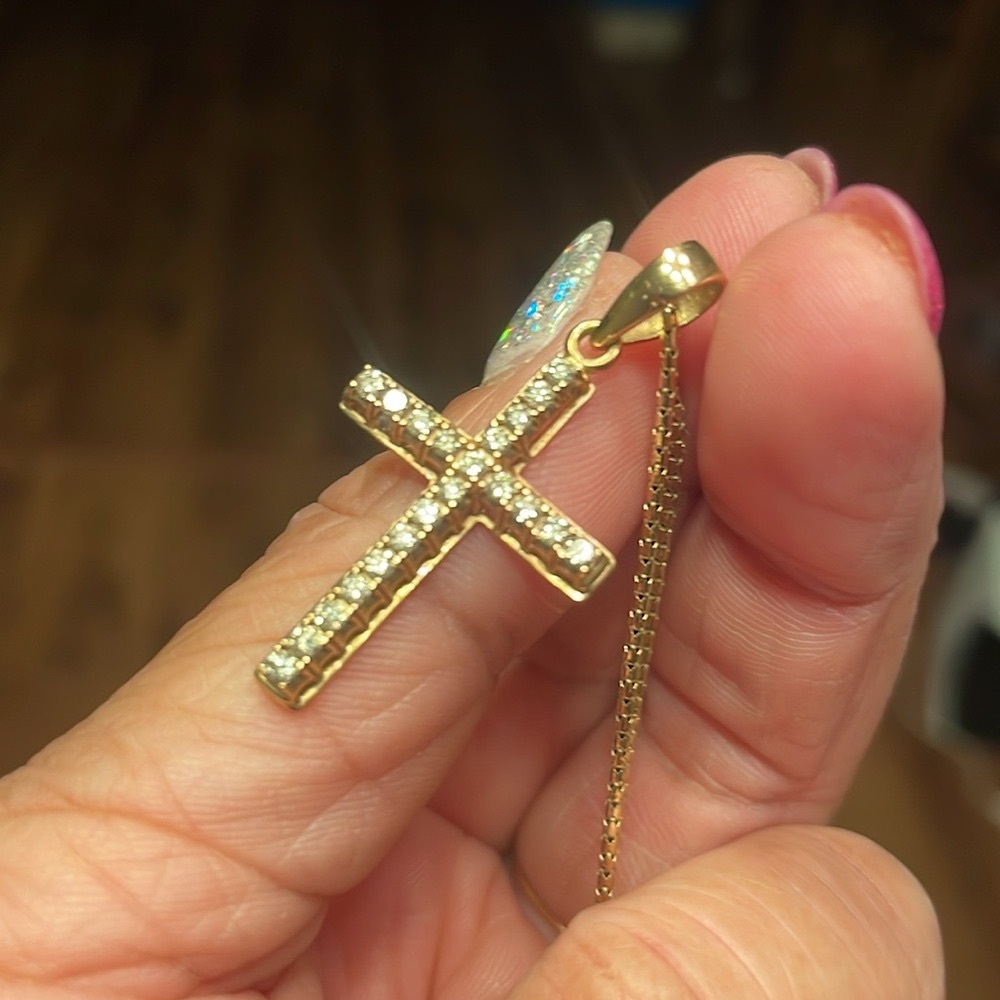 Genuine 14 karat yellow gold with .63ct earth mined bright white diamonds cross